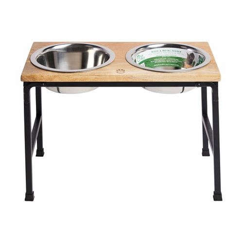 Wooden pet feeding station with two stainless steel bowls on a white background