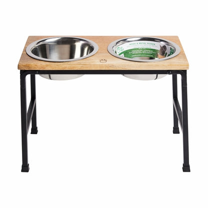Wooden pet feeding station with two stainless steel bowls on a white background