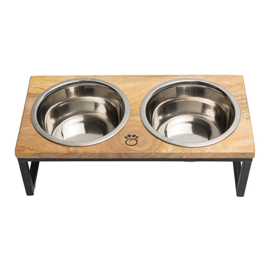 Wooden pet feeder with two stainless steel bowls on a white background